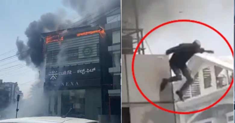 ഗ്യാസ് സിലിണ്ടറുകള്‍ പൊട്ടിത്തെറിച്ചു; ബംഗളൂരുവില്‍ നാല് നില കെട്ടിടത്തില്‍ വന്‍തീപിടിത്തം; രക്ഷപ്പെടാനായി റൂഫ് ടോപ്പില്‍ നിന്നും താഴേക്ക് ചാടി യുവാവ്